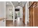 Grand foyer featuring wood floors, brick ceiling, custom woodwork, and elegant lighting at 212 Fernwood Pl, Woodstock, GA 30188