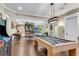 Spacious game room with a pool table, ping pong table, and arcade games at 212 Fernwood Pl, Woodstock, GA 30188