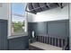 An organized garage corner with a bench, storage cabinet, and tire rack, maximizing space and ensuring convenience at 212 Fernwood Pl, Woodstock, GA 30188