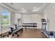 Spacious gym with an elliptical machine and weight training area at 212 Fernwood Pl, Woodstock, GA 30188
