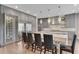Gourmet kitchen with hidden walk in pantry and stainless steel appliances, a large island, and counter seating at 212 Fernwood Pl, Woodstock, GA 30188