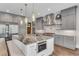 Spacious kitchen with stainless appliances, wine fridge and large island for entertaining at 212 Fernwood Pl, Woodstock, GA 30188