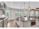 Open kitchen with views of the back yard and windows that provide natural lighting at 212 Fernwood Pl, Woodstock, GA 30188