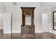 Living room showcases a unique wooden cabinet with interior door opened, adding architectural interest to the space at 212 Fernwood Pl, Woodstock, GA 30188