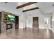 Open main bedroom features hardwood floors, stone fireplace, built-ins, and vaulted ceilings at 212 Fernwood Pl, Woodstock, GA 30188