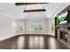 Light-filled main bedroom features hardwood floors, fireplace, and great natural light at 212 Fernwood Pl, Woodstock, GA 30188