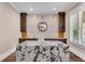 Well-lit office with white and wood accents, built-in shelves, granite countertop and window at 212 Fernwood Pl, Woodstock, GA 30188