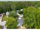 An aerial view of a home surrounded by mature trees in a residential neighborhood at 3285 Country Walk Dr, Powder Springs, GA 30127