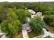 An aerial view of the home in a neighborhood surrounded by mature trees at 3285 Country Walk Dr, Powder Springs, GA 30127
