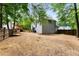An overview of a backyard with a new deck, wood fence, and gray vinyl siding at 3285 Country Walk Dr, Powder Springs, GA 30127
