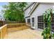 A wooden backyard deck with walkout access to a fenced-in yard at 3285 Country Walk Dr, Powder Springs, GA 30127