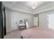 Bedroom featuring a tray ceiling, a vanity, and lots of natural light at 3285 Country Walk Dr, Powder Springs, GA 30127