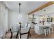 Open concept design featuring a dining table next to the updated kitchen at 3285 Country Walk Dr, Powder Springs, GA 30127