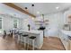 Bright and airy kitchen with a large island, white cabinets, and stainless steel appliances, next to the dining area at 3285 Country Walk Dr, Powder Springs, GA 30127