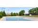 Enjoy the community sports court, ideal for basketball, tennis, and other games surrounded by greenery at 3285 Country Walk Dr, Powder Springs, GA 30127