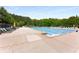 Lounge by the sparkling community swimming pool featuring a shallow end and ample seating at 3285 Country Walk Dr, Powder Springs, GA 30127