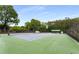 Enjoy a game on the community tennis court, surrounded by lush greenery and well-maintained fencing at 3285 Country Walk Dr, Powder Springs, GA 30127