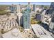 Aerial view of a high-rise building surrounded by the cityscape and lush greenery at 3338 Peachtree Rd # Apt 403, Atlanta, GA 30326