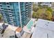 Aerial view of building featuring a pool and deck area at 3338 Peachtree Rd # Apt 403, Atlanta, GA 30326