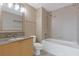 This bathroom features tile shower with a tub, updated fixtures and a granite countertop vanity at 3338 Peachtree Rd # Apt 403, Atlanta, GA 30326