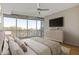 This bedroom features natural light with a balcony, modern furnishings and decor at 3338 Peachtree Rd # Apt 403, Atlanta, GA 30326