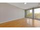 Bright bedroom featuring hardwood floors and a balcony providing a relaxing space in the home at 3338 Peachtree Rd # Apt 403, Atlanta, GA 30326
