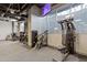 Modern gym featuring various exercise machines and mounted televisions for entertainment at 3338 Peachtree Rd # Apt 403, Atlanta, GA 30326