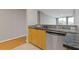 Kitchen with stainless steel dishwasher and granite countertops, blending functionality with modern design at 3338 Peachtree Rd # Apt 403, Atlanta, GA 30326