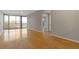 Spacious living room featuring hardwood floors and large windows offering ample natural light and access to a balcony at 3338 Peachtree Rd # Apt 403, Atlanta, GA 30326