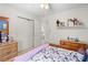 Cozy bedroom with a view of the closet and light coming in through a window at 3472 Honeycomb Se Dr, Conyers, GA 30094
