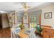 Dining area features large windows, wood floors, and staircase access at 3472 Honeycomb Se Dr, Conyers, GA 30094