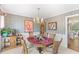 Formal dining room featuring a chandelier, wallpaper, and elegant décor at 3472 Honeycomb Se Dr, Conyers, GA 30094