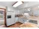 Updated kitchen with white cabinets, stone backsplash, and stainless appliances at 3472 Honeycomb Se Dr, Conyers, GA 30094