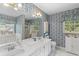 Main bathroom with dual vanity, shower, and wallpaper at 3472 Honeycomb Se Dr, Conyers, GA 30094