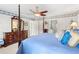 Main bedroom with four poster bed, dresser, and private bath access at 3472 Honeycomb Se Dr, Conyers, GA 30094