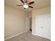 Bedroom with neutral walls, carpet and ceiling fan, adjacent to closet and entrance at 4024 Broadmoor Sw Ct, Austell, GA 30106