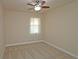 Bedroom with neutral walls, carpet and a ceiling fan, featuring lots of light at 4024 Broadmoor Sw Ct, Austell, GA 30106