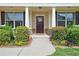 Home's inviting entryway with decorative wreath and manicured bushes at 4024 Broadmoor Sw Ct, Austell, GA 30106