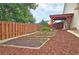 Well-maintained backyard garden with raised beds and wood mulch at 4024 Broadmoor Sw Ct, Austell, GA 30106