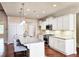 Modern kitchen featuring granite countertops, stainless steel appliances, and island with barstool seating at 4024 Broadmoor Sw Ct, Austell, GA 30106
