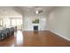 Spacious living room featuring a fireplace, vaulted ceiling, and views of the kitchen and breakfast bar at 4024 Broadmoor Sw Ct, Austell, GA 30106
