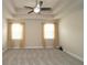 Spacious main bedroom with tray ceiling, plush carpet, and large windows providing ample natural light at 4024 Broadmoor Sw Ct, Austell, GA 30106
