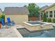 Backyard with a stunning pool, spa and serene waterfall feature, providing a peaceful retreat for relaxation and enjoyment at 4024 Broadmoor Sw Ct, Austell, GA 30106