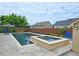 Inviting in-ground pool and hot tub surrounded by concrete pavers and features landscaping at 4024 Broadmoor Sw Ct, Austell, GA 30106