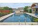 Backyard featuring a beautiful pool, spa, and outdoor seating for relaxation and entertaining at 4024 Broadmoor Sw Ct, Austell, GA 30106