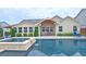 View of the in-ground pool, and outdoor living space featuring a dining set and a sunroom at 4024 Broadmoor Sw Ct, Austell, GA 30106