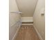 Unfinished storage area featuring shelving and wall to wall carpeting at 4024 Broadmoor Sw Ct, Austell, GA 30106