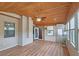 Bright sunroom featuring many windows, a ceiling fan, wood flooring, and a wooden ceiling at 4024 Broadmoor Sw Ct, Austell, GA 30106