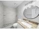 Modern bathroom boasts granite counters, shower with decorative tile and glass door at 12 Dunwoody Springs Dr # 12, Atlanta, GA 30328