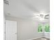 Bedroom featuring a ceiling fan and a view of the trees through the window at 12 Dunwoody Springs Dr # 12, Atlanta, GA 30328